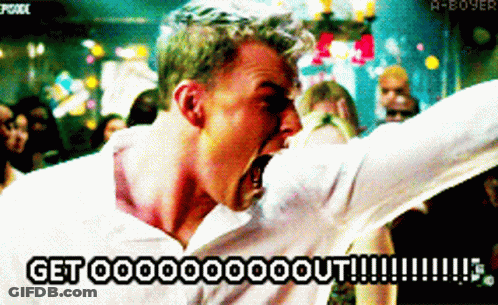 A Man In A White Shirt Is Screaming With The Words Get Ooooooo Out Written On The Bottom GIF