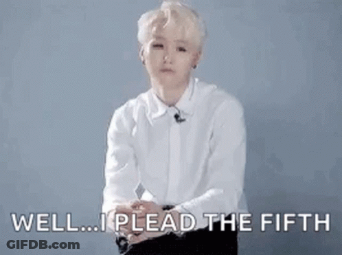 A Man In A White Shirt Is Sitting Down With His Hands Outstretched And Says `` Well ... I Plead The Fifth '' . GIF