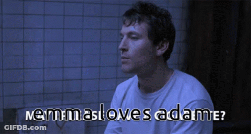 Man In White Shirt Sitting With Nemmasloves Adame Text GIF