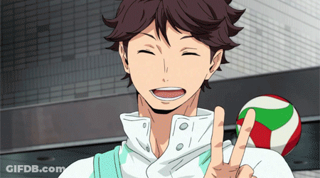 A Man In A White Shirt Is Smiling And Giving A Peace Sign GIF