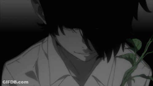 A Man In A White Shirt Is Standing In A Dark Room GIF
