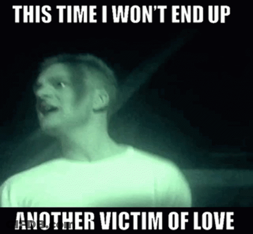 A Man In A White Shirt Is Standing In A Dark Room And Says This Time I Won 'T End Up GIF