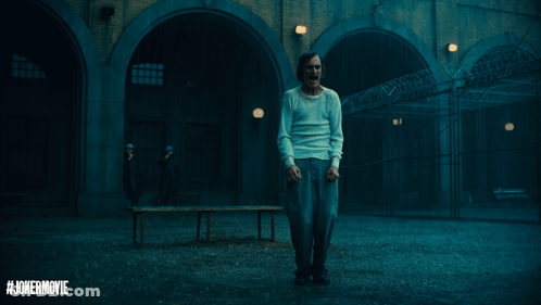 Man In White Shirt In Dark Room With Jokermovie GIF