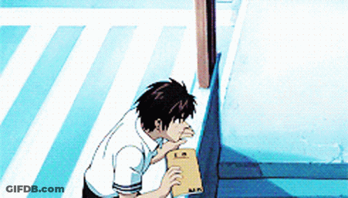 A Man In A White Shirt Is Standing On A Sidewalk Holding A Piece Of Paper With The Letter M On It .. GIF