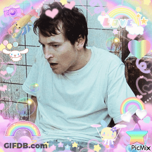 Man In White Shirt Surrounded By Rainbows And Hearts GIF