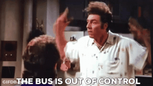 A Man In A White Shirt Is Talking To Another Man In A Kitchen And The Words The Bus Is Out Of Control Are Visible . GIF