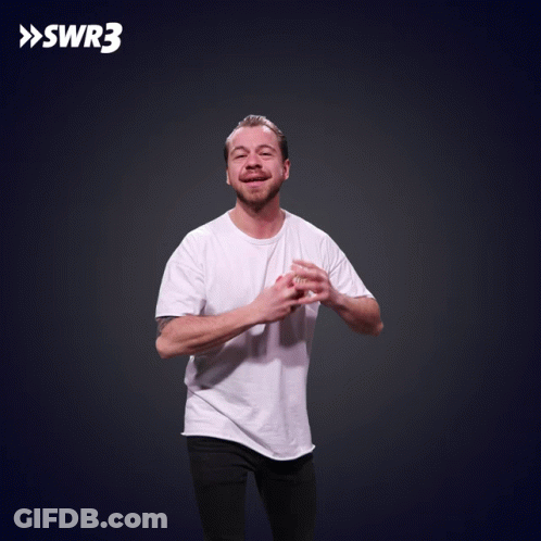 A Man In A White Shirt Is Throwing Food In The Air With Swr3 In The Corner GIF