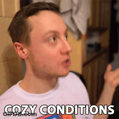 A Man In A White Shirt Says Cozy Conditions In Black Letters GIF