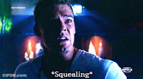 A Man In A White Shirt Says " Squealing " On The Screen GIF