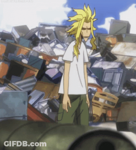 A Man In A White Shirt Stands In Front Of A Pile Of Junk GIF