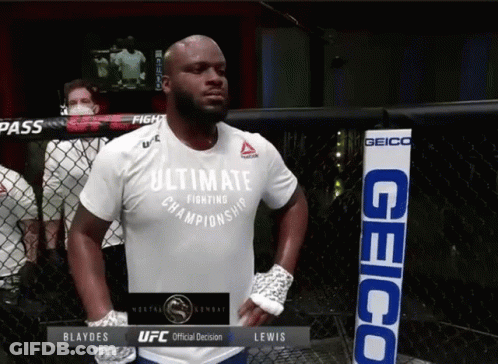 A Man In A White Shirt That Says Ultimate Championship GIF