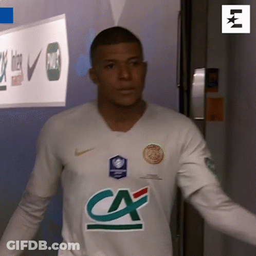 A Man In A White Shirt With A Ca Logo On The Front GIF