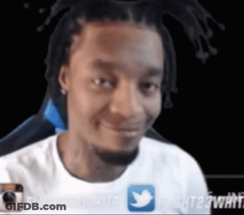 A Man In A White Shirt With A Twitter Icon On It GIF