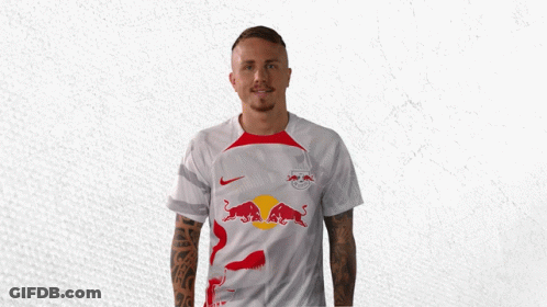 A Man In A White Shirt With Red Bulls On It GIF