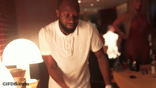 A Man In A White Shirt With The Letter O On It GIF