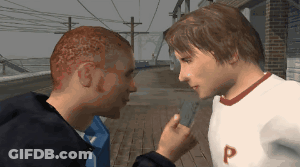 A Man In A White Shirt With The Letter P On It Is Talking To Another Man GIF