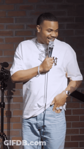 A Man In A White Shirt With The Letter W On It GIF