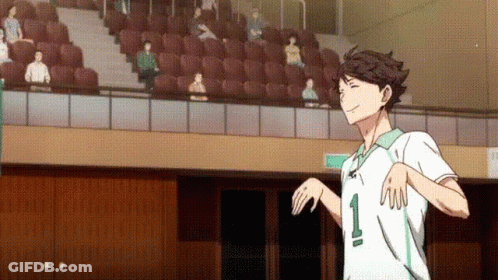 A Man In A White Shirt With The Number 1 On It Is Standing In Front Of A Crowd Of People In A Stadium . GIF