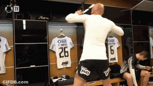 A Man In A White Shirt With The Number 26 On The Back GIF