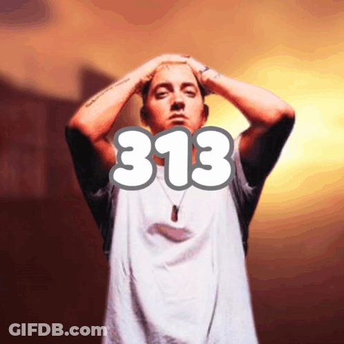A Man In A White Shirt With The Number 313 On It GIF