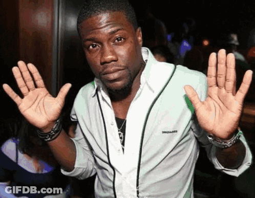 A Man In A White Shirt With The Word Dsquared On The Front GIF