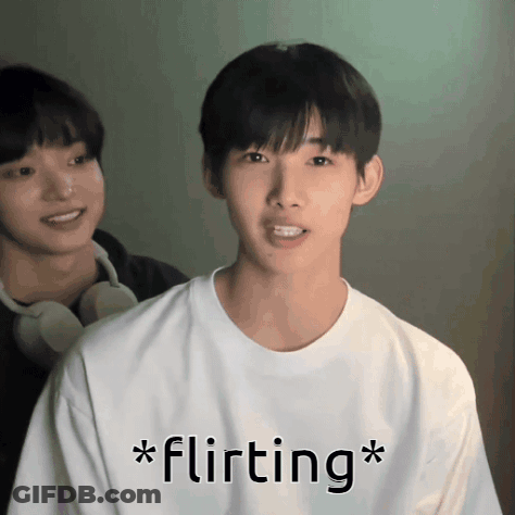 A Man In A White Shirt With The Word Flirting Written On It GIF