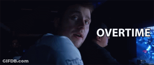 A Man In A White Shirt With The Word Twitch On The Sleeve Looks Over His Shoulder GIF