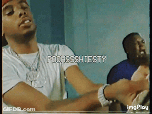 A Man In A White Shirt With The Words Poohssshiesty On The Screen GIF