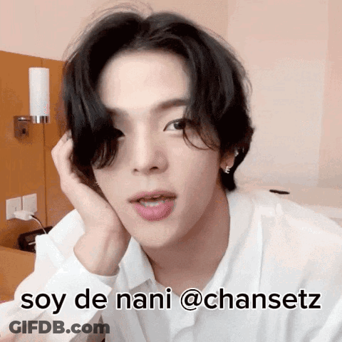 A Man In A White Shirt With The Words Soy De Nani @Chansetz On His Face GIF