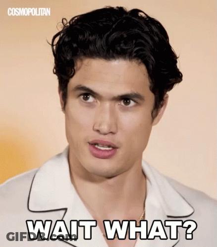 A Man In A White Shirt With The Words Wait What On His Face GIF