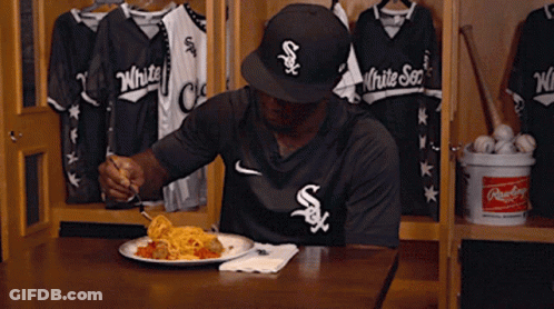 A Man In A White Sox Jersey Is Eating Spaghetti GIF