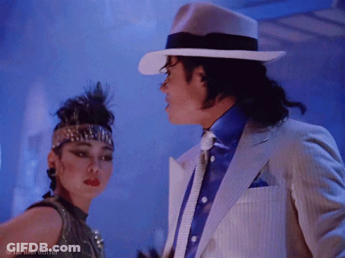 White Suit And Hat Man Dancing With Woman GIF