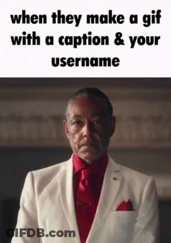 Man In White Suit And Red Tie With Caption GIF