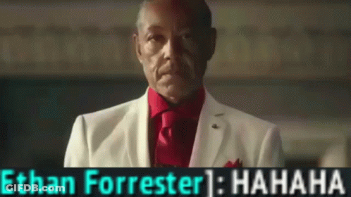 A Man In A White Suit And Red Tie With The Name Ethan Forrester On The Bottom GIF