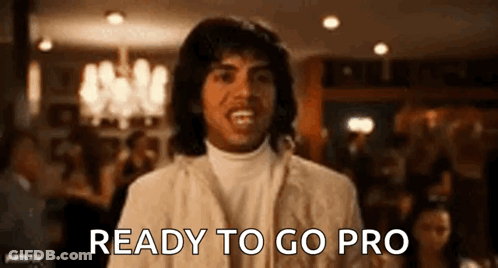 A Man In A White Suit Is Ready To Go Pro In A Restaurant . GIF