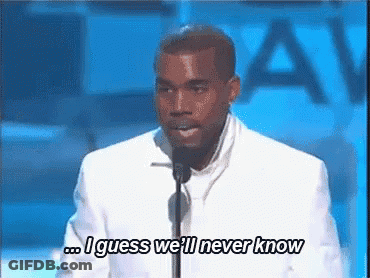 A Man In A White Suit Is Speaking Into A Microphone And Saying `` I Guess We 'Ll Never Know `` . GIF