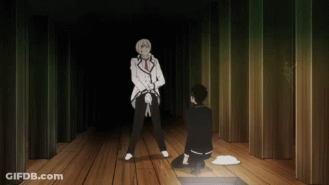 A Man In A White Suit Is Standing Next To A Man In A Black Suit On A Wooden Floor GIF