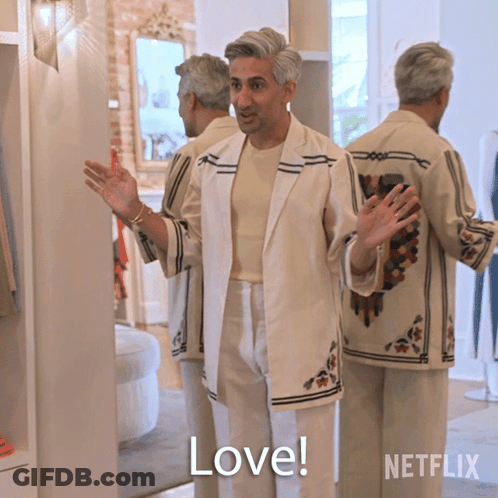 A Man In A White Suit Says " Love " GIF