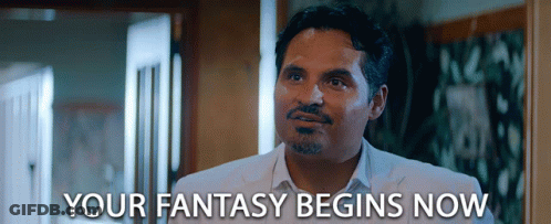 A Man In A White Suit Says " Your Fantasy Begins Now " In Front Of Him GIF