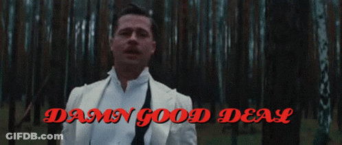 A Man In A White Suit Stands In A Forest With The Words Damn Good Deal GIF