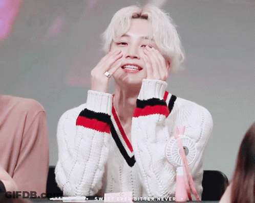 A Man In A White Sweater Covering His Face With His Hands With The Words Sweet Ever Bitter Never Below Him GIF