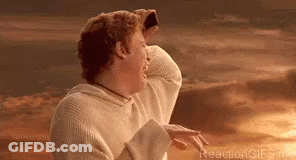 A Man In A White Sweater Is Standing In Front Of A Sunset With His Hands On His Head . GIF