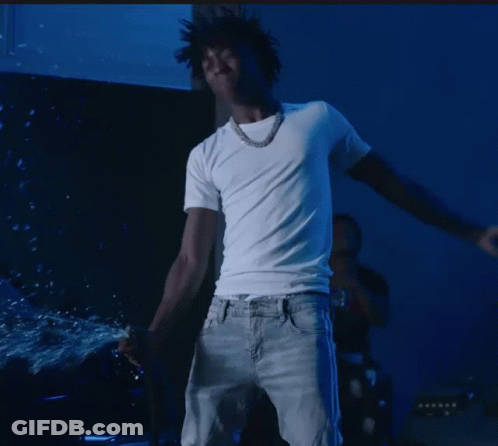 A Man In A White T-Shirt And Jeans Is Dancing GIF