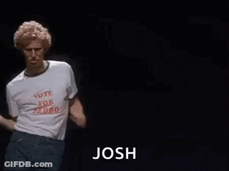 A Man In A White T-Shirt Is Dancing On A Stage With The Word Josh . GIF