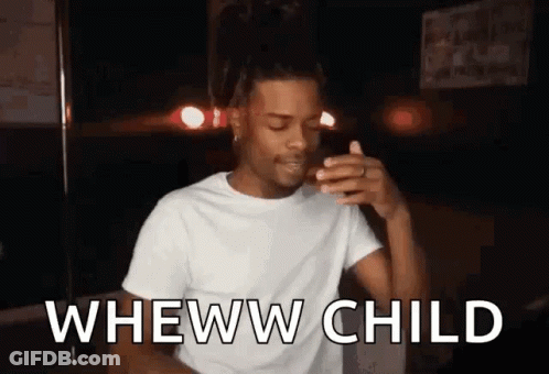 A Man In A White T-Shirt Is Making A Funny Face While Holding A Cigarette In His Hand . GIF