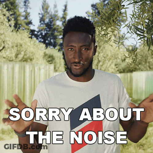 A Man In A White T-Shirt Says " Sorry About The Noise " GIF