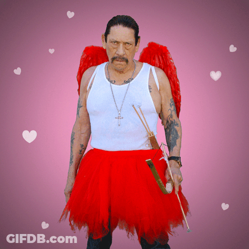 A Man In A White Tank Top And A Red Skirt Is Holding An Arrow GIF