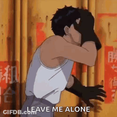 A Man In A White Tank Top And Black Gloves Is Covering His Face With His Hands And Says `` Leave Me Alone '' . GIF