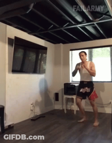 A Man In A White Tank Top And Shorts With The Word Fail Army On The Bottom Right GIF