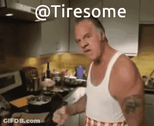 A Man In A White Tank Top Is Cooking In A Kitchen And The Words @Tiresome Are Above Him GIF